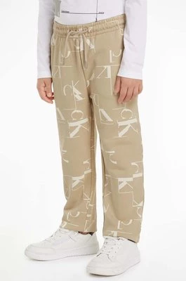 Calvin Klein Jeans spodnie dresowe bawełniane dziecięce TERRY JOGGER kolor beżowy wzorzyste IB0IB02124