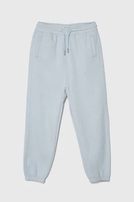 Calvin Klein Jeans spodnie dresowe dziecięce kolor niebieski z aplikacją