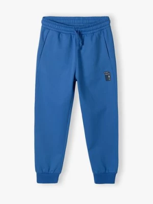 Niebieskie spodnie dresowe regular z kieszeniami dla chłopca Lincoln & Sharks by 5.10.15.