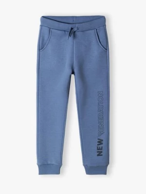 Spodnie dresowe niebieskie z napisem na nogawce- New generation Lincoln & Sharks by 5.10.15.