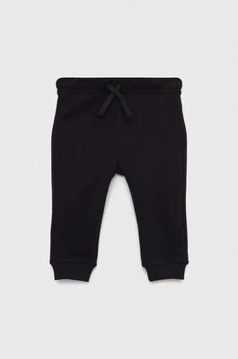 United Colors of Benetton spodnie dresowe bawełniane dziecięce kolor czarny gładkie